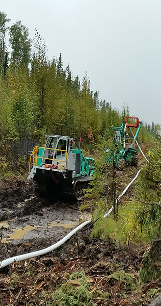 ITS machines laying pipe in a forest